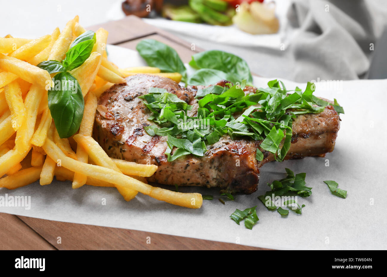 Delicious grilled steak frites on waxed paper Stock Photo Alamy