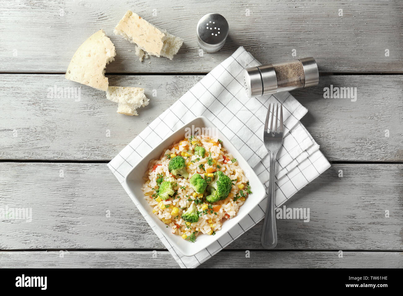 Delicious rice pilaf with broccoli in bowl on table Stock Photo - Alamy
