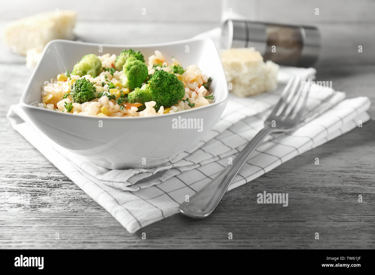 Delicious rice pilaf with broccoli in bowl on table Stock Photo - Alamy