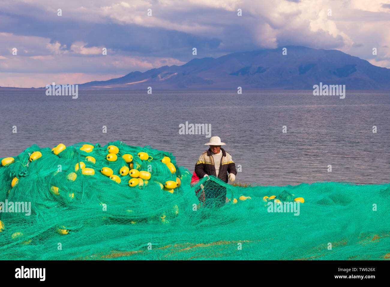 Fishing on the shore of Sayram Lake, Yining (Ghulja), Xinjiang Province, China Stock Photo