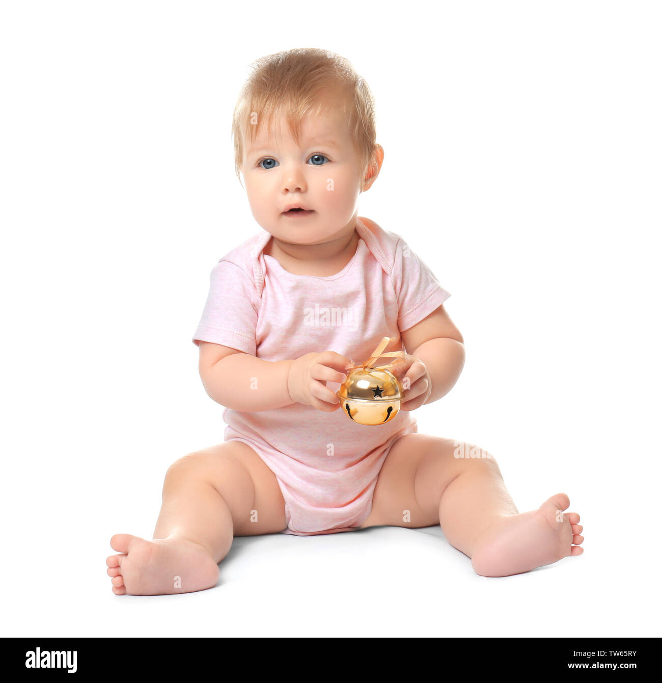 Adorable baby with jingle bell on white background Stock Photo Alamy