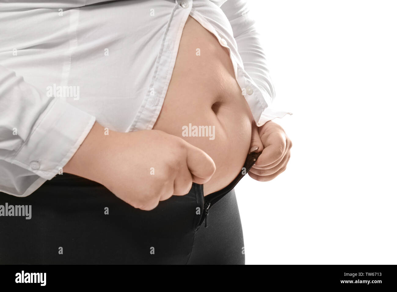 Overweight woman in tight clothes on white background, closeup. Weight loss  concept Stock Photo - Alamy