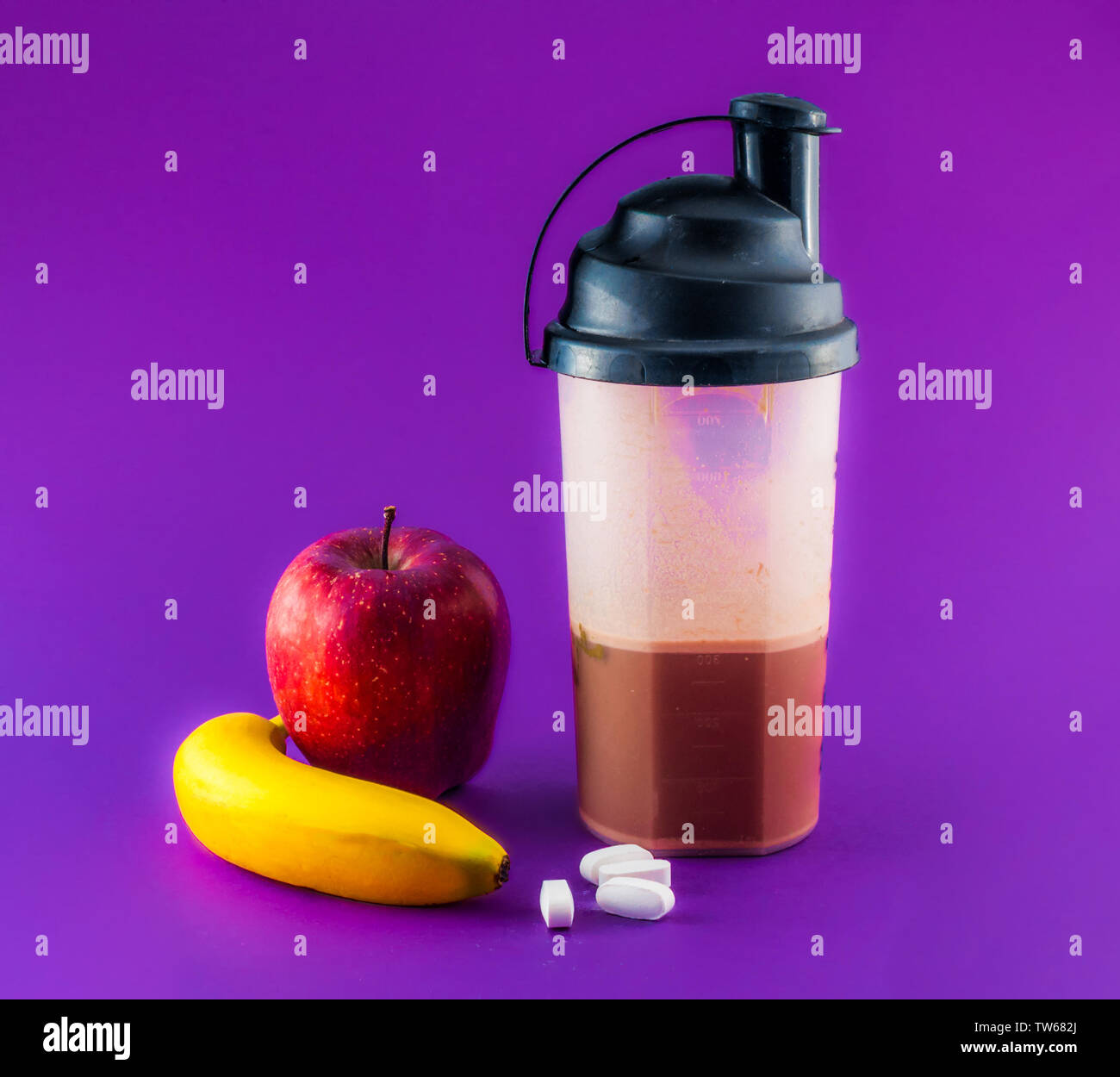 post workout meal with whey protein, shaker, banana and apple Stock Photo Alamy