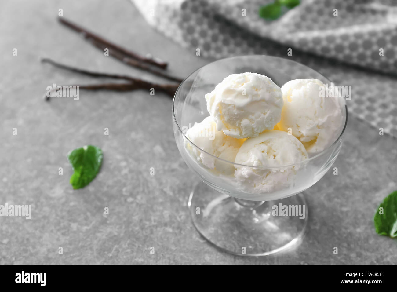 Glass bowl with yummy vanilla ice cream on table Stock Photo - Alamy