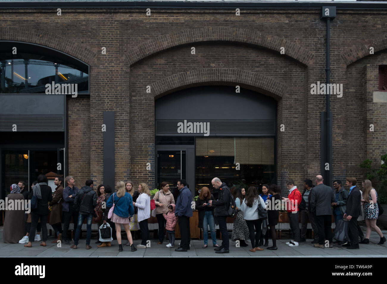Large group of people outside of a building hi-res stock photography ...