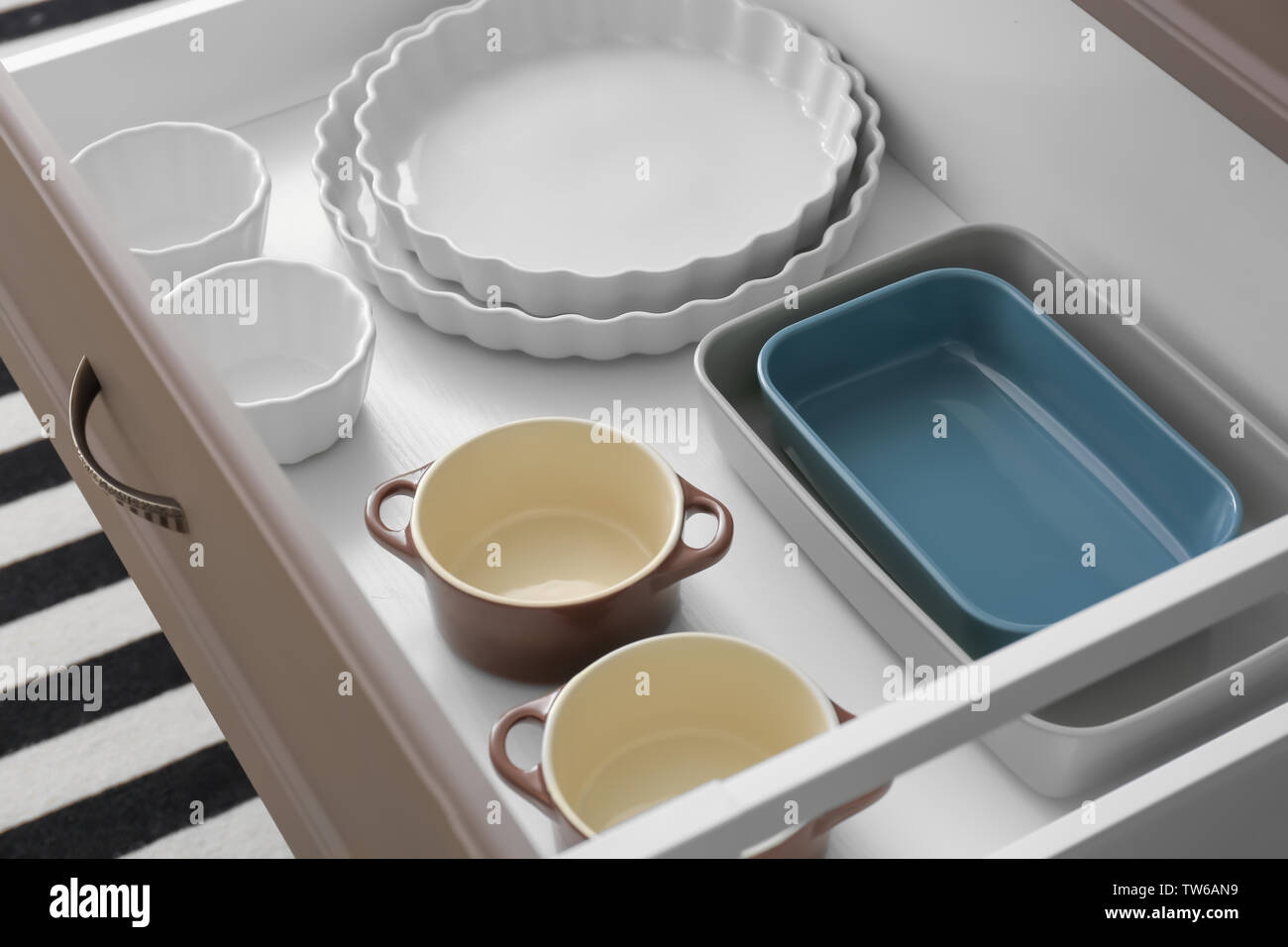Set of kitchenware in drawer indoors Stock Photo - Alamy