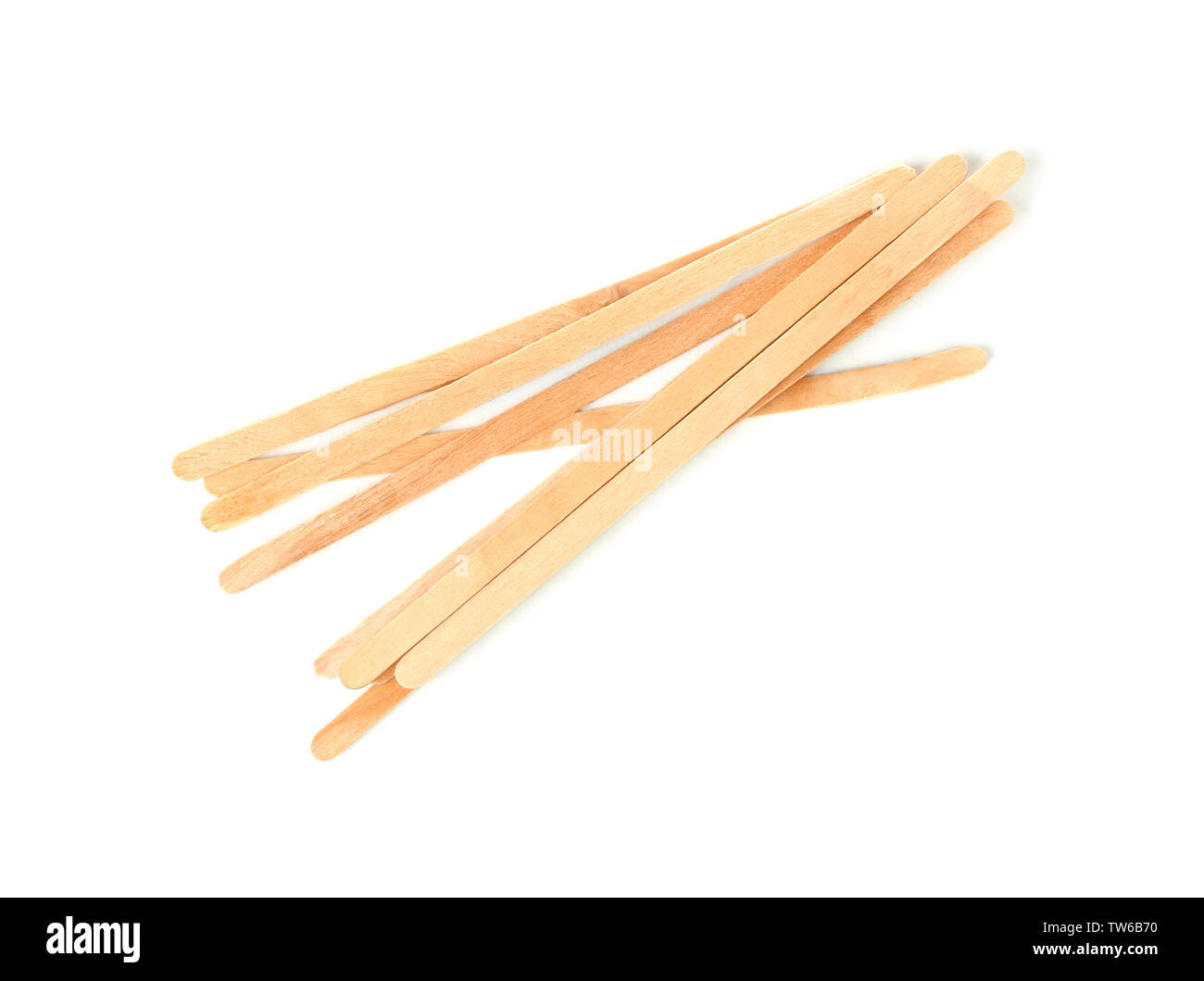 Wooden coffee stirrers on white background Stock Photo - Alamy