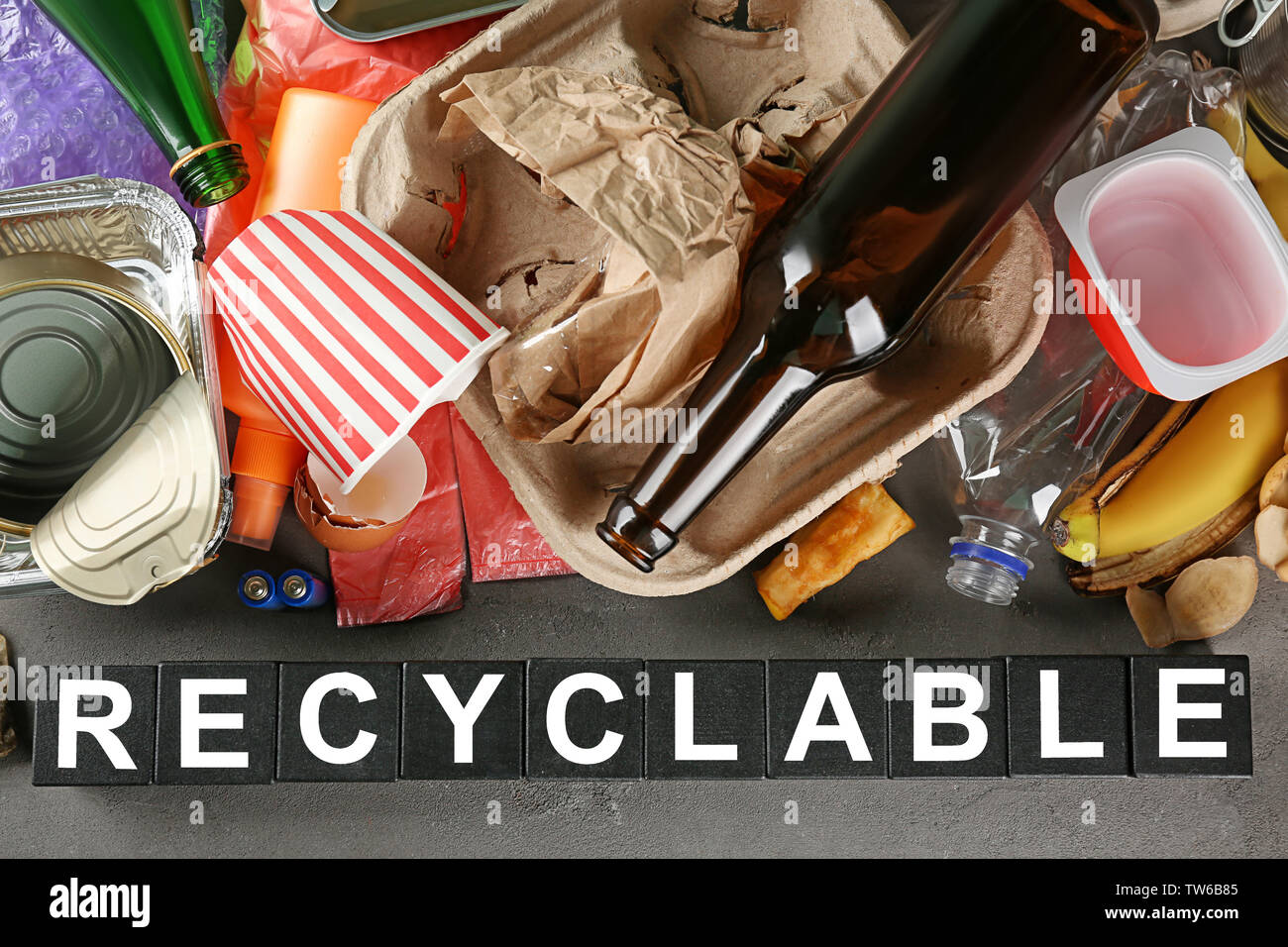 Composition with garbage and word Recyclable on grey background Stock Photo