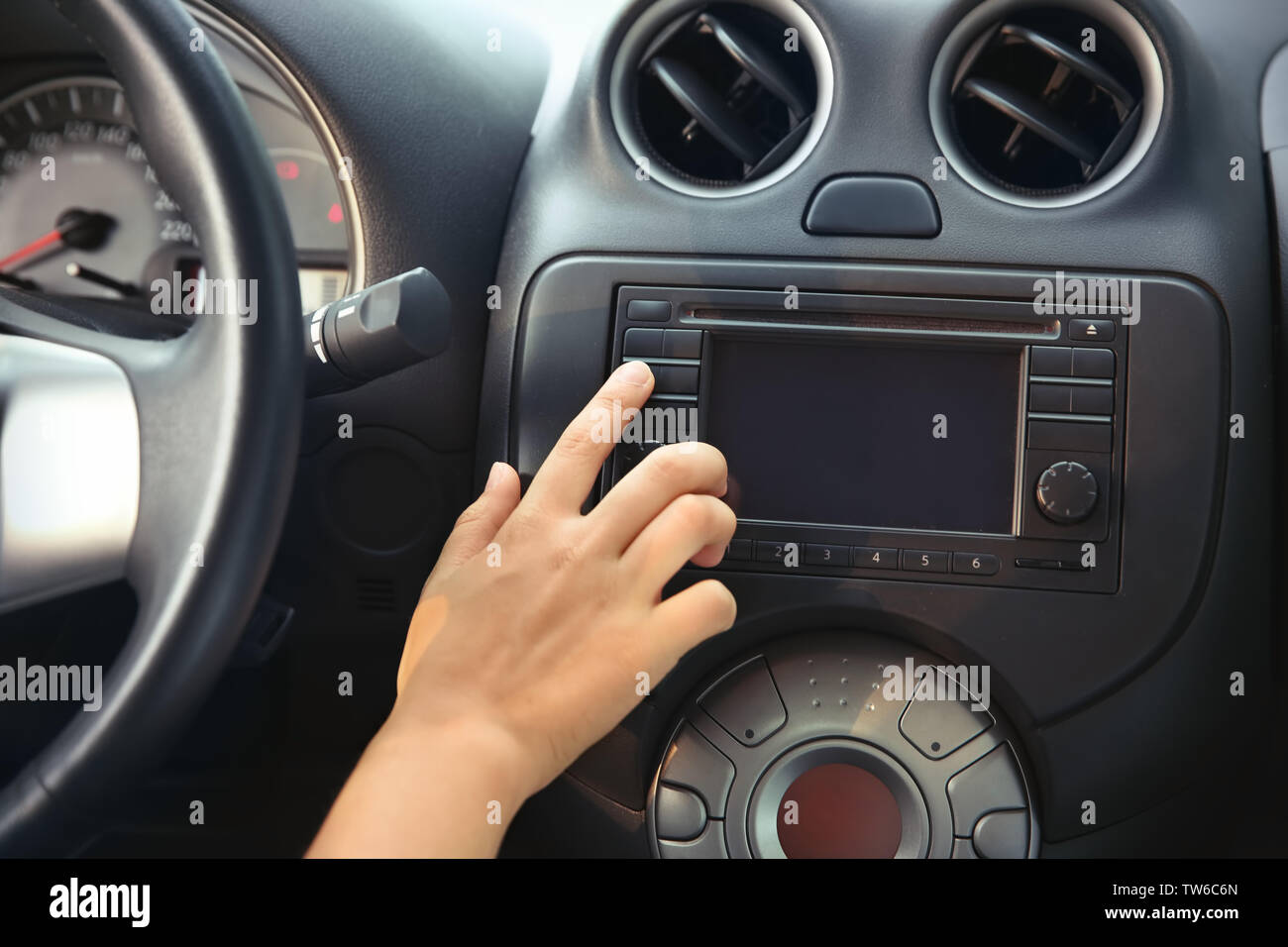 Woman tuning radio in car Stock Photo Alamy