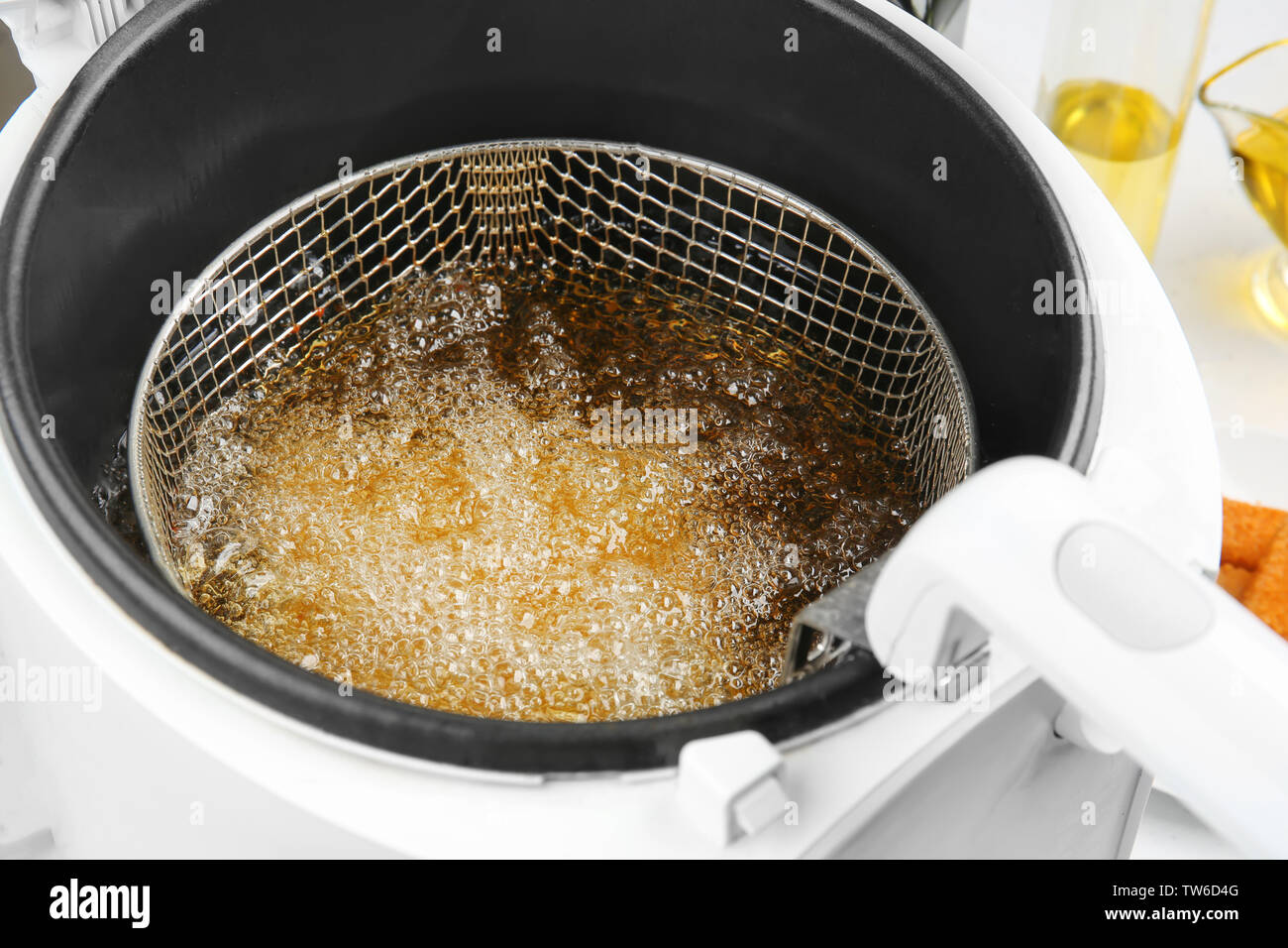 Deep fryer with boiling oil, closeup Stock Photo Alamy