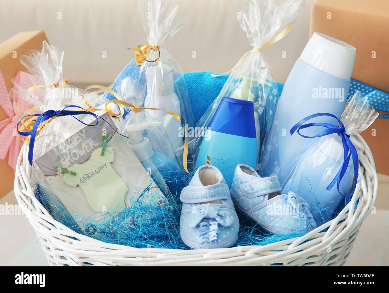 Wicker Basket With Baby Shower Gifts Indoors Stock Photo Alamy