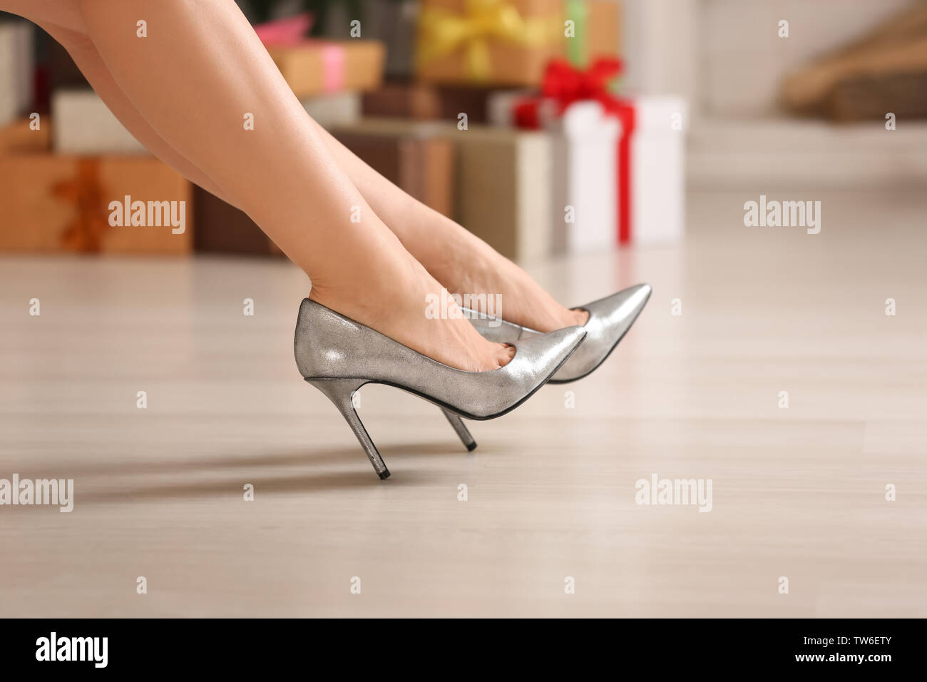 Woman in high heel shoes at home Stock Photo