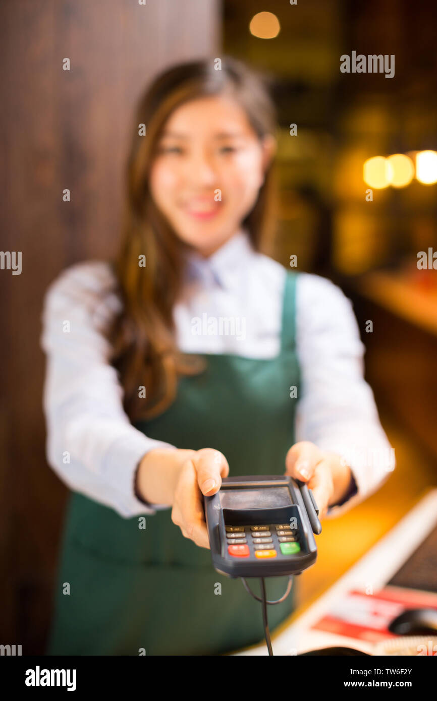 Make Waiters Make it waitress and waiter in cafe Stock Photo - Alamy