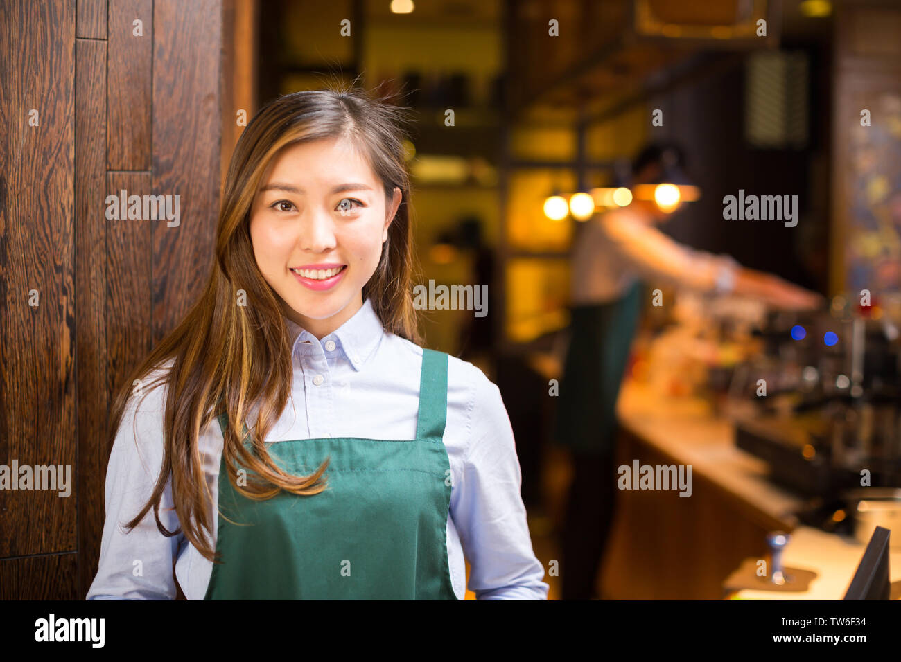 Make Waiters Make it waitress and waiter in cafe Stock Photo - Alamy