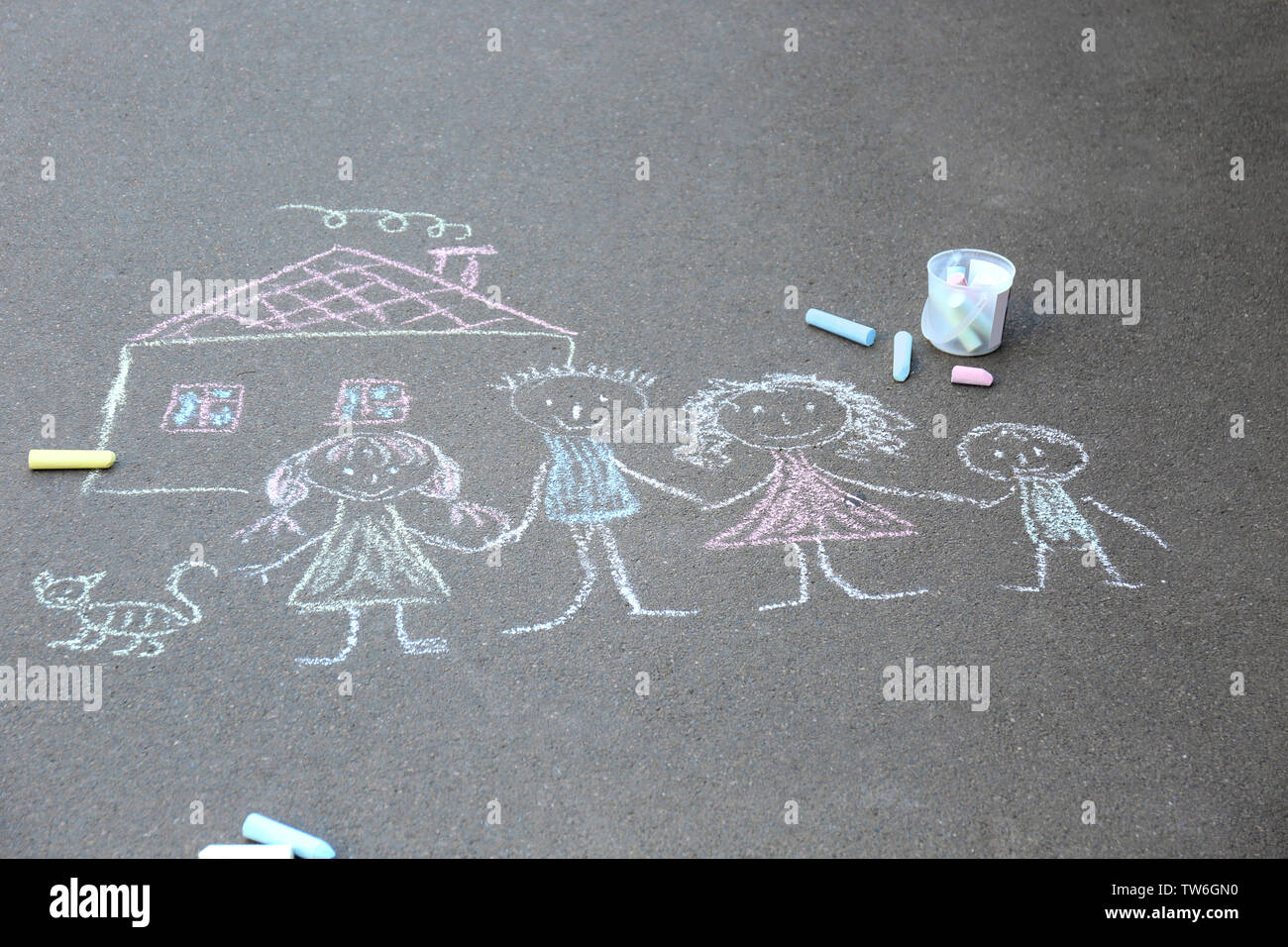 Chalk drawing of family and house on asphalt Stock Photo - Alamy