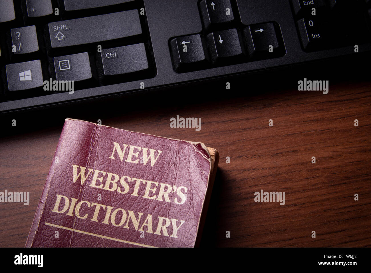 Dictionary and Keyboard - Old School Spellcheck Stock Photo
