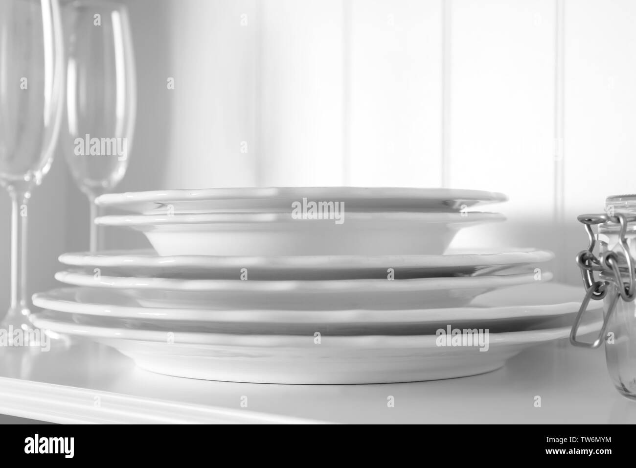 White storage stand with dishware in kitchen Stock Photo Alamy