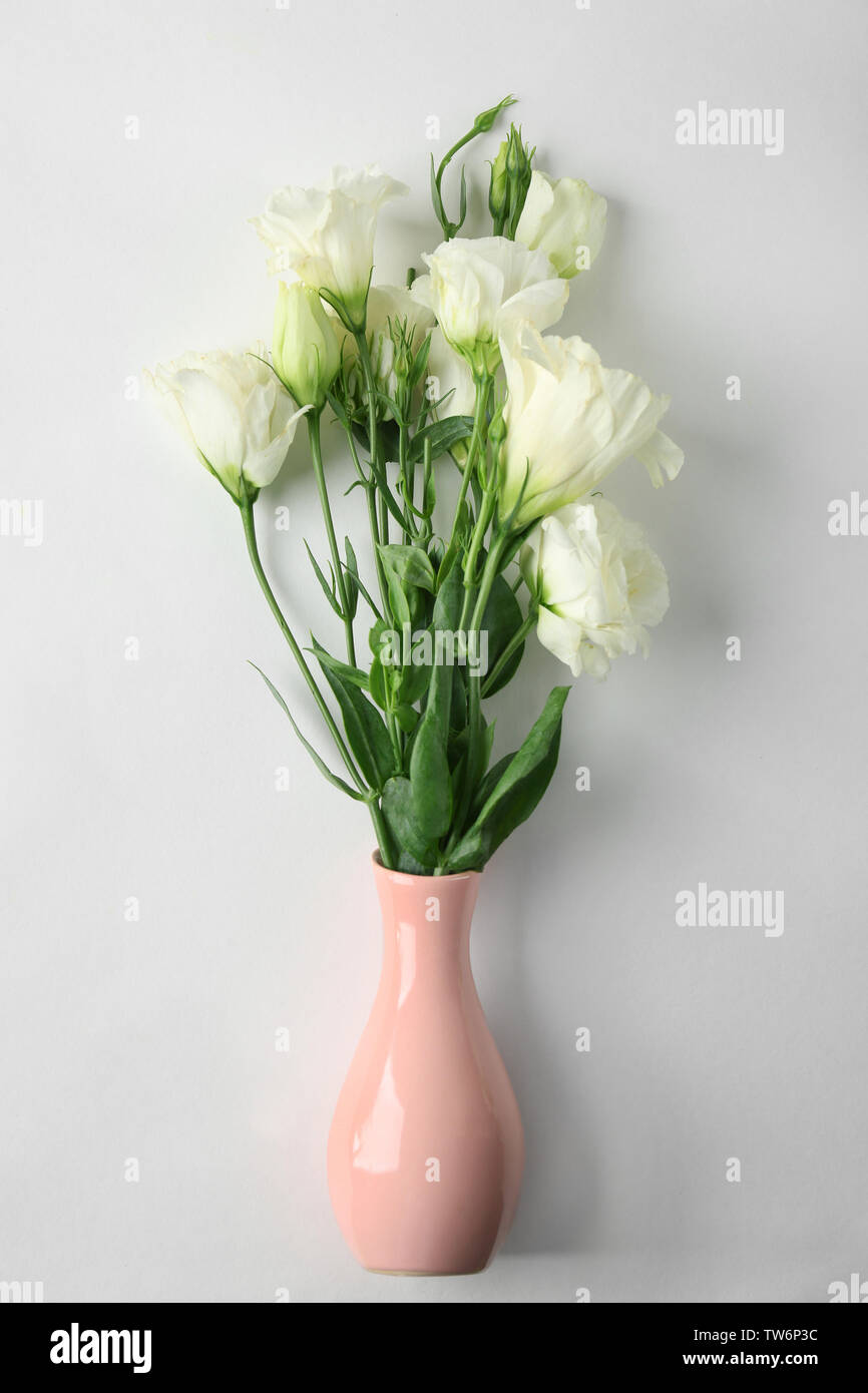 Vase with beautiful flowers on white background Stock Photo - Alamy