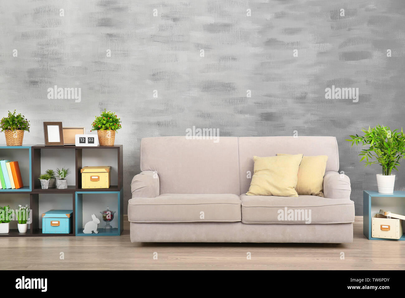Modern living room with cozy sofa Stock Photo - Alamy