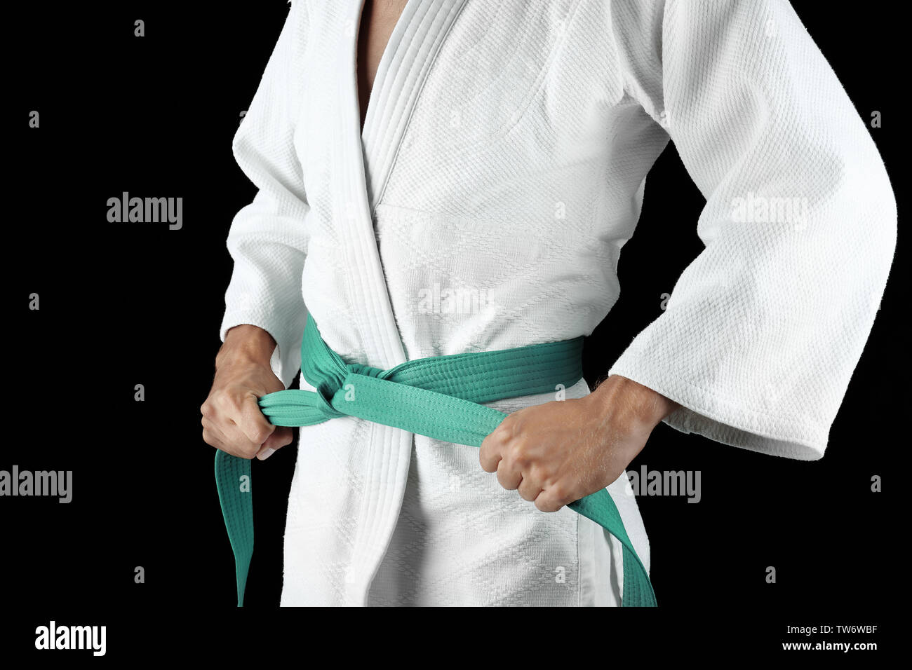 Man in karategi on dark background Stock Photo - Alamy