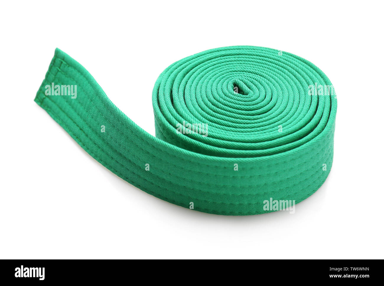 Green karate belt on white background Stock Photo - Alamy