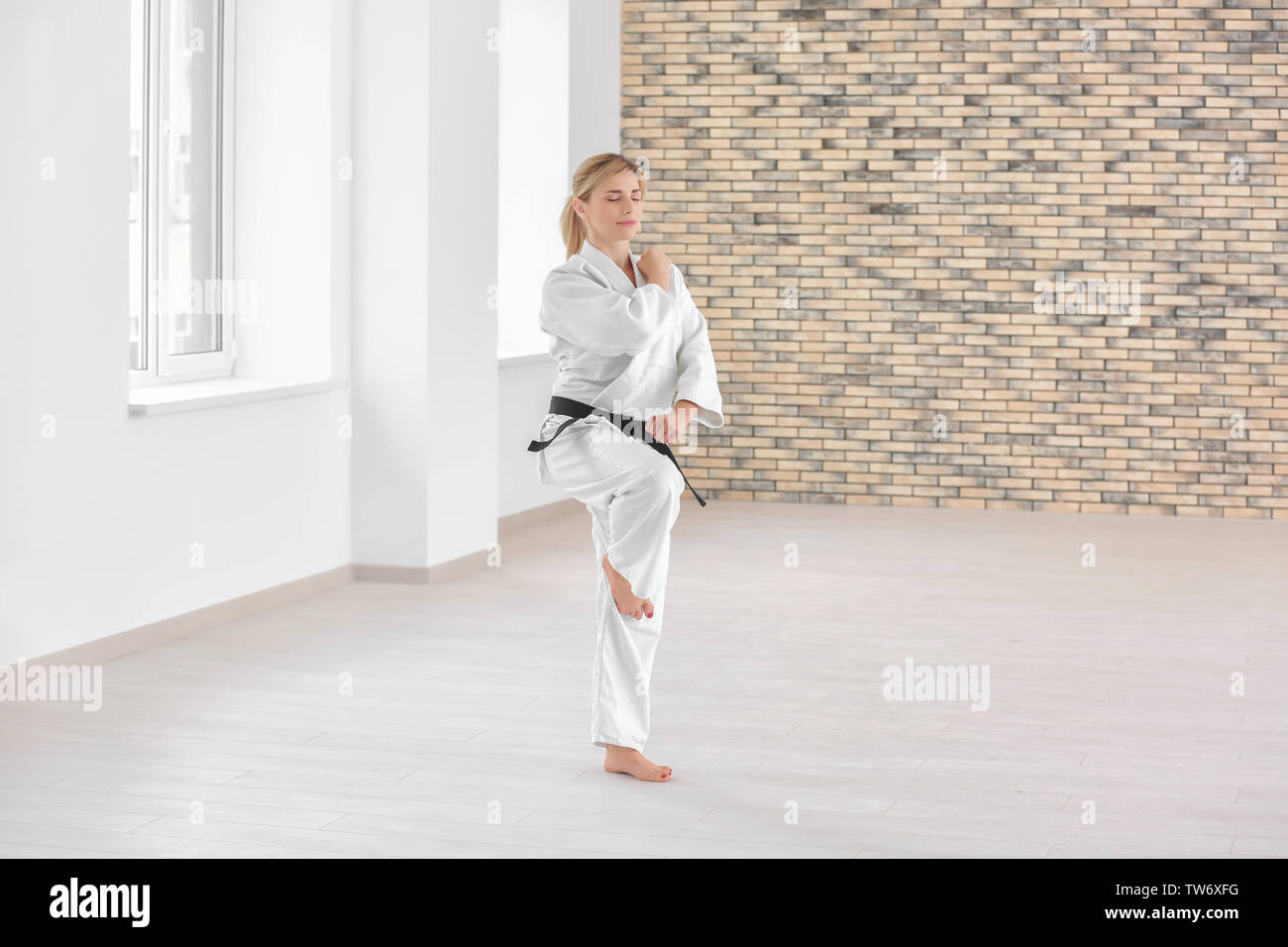 Female karate instructor training in dojo Stock Photo Alamy