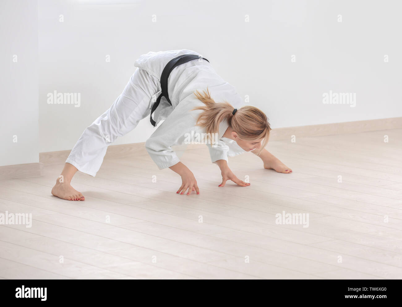 Female karate instructor stretching in dojo Stock Photo Alamy