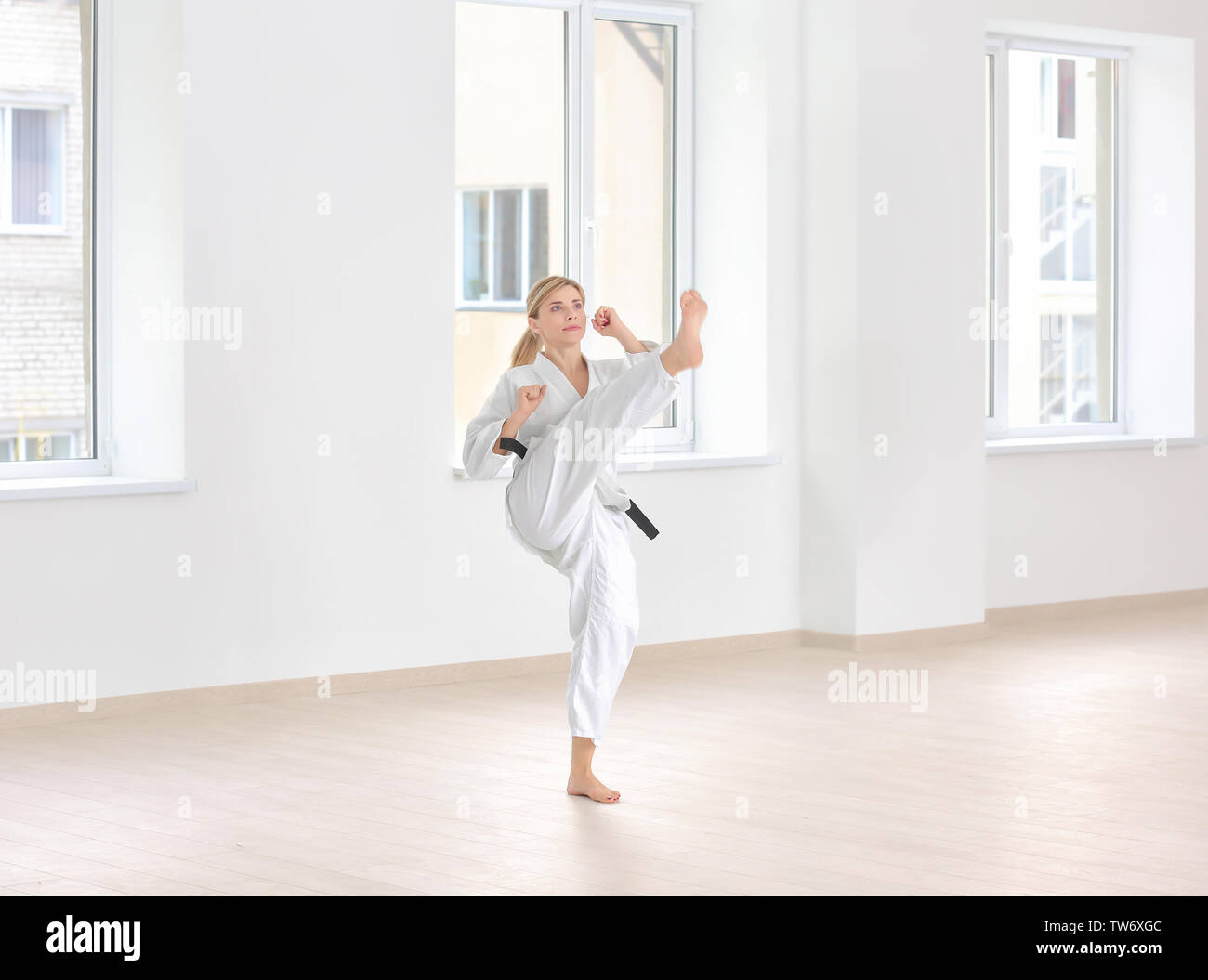 Female karate instructor training in dojo Stock Photo Alamy