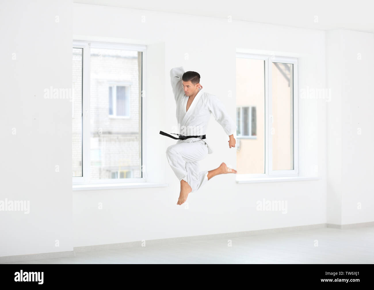 Dojo Workout Male karate instructor training in dojo Stock Photo - Alamy