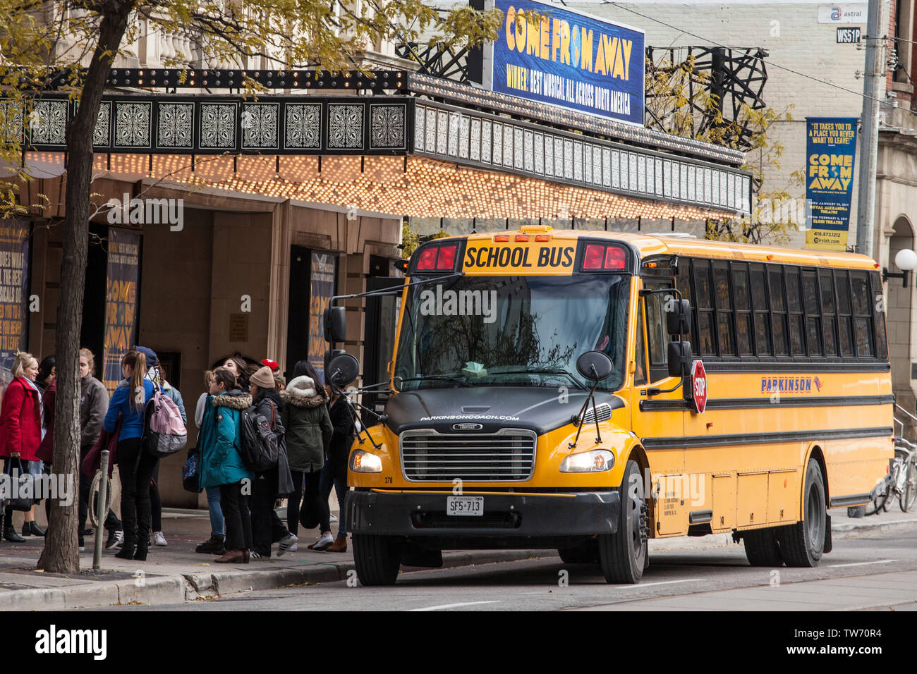 TORONTO, CANADA - NOVEMBER 14, 2018: North American Yellow School Bus parked on a street, waiting for students to go out in a downtown area of Toronto Stock Photo