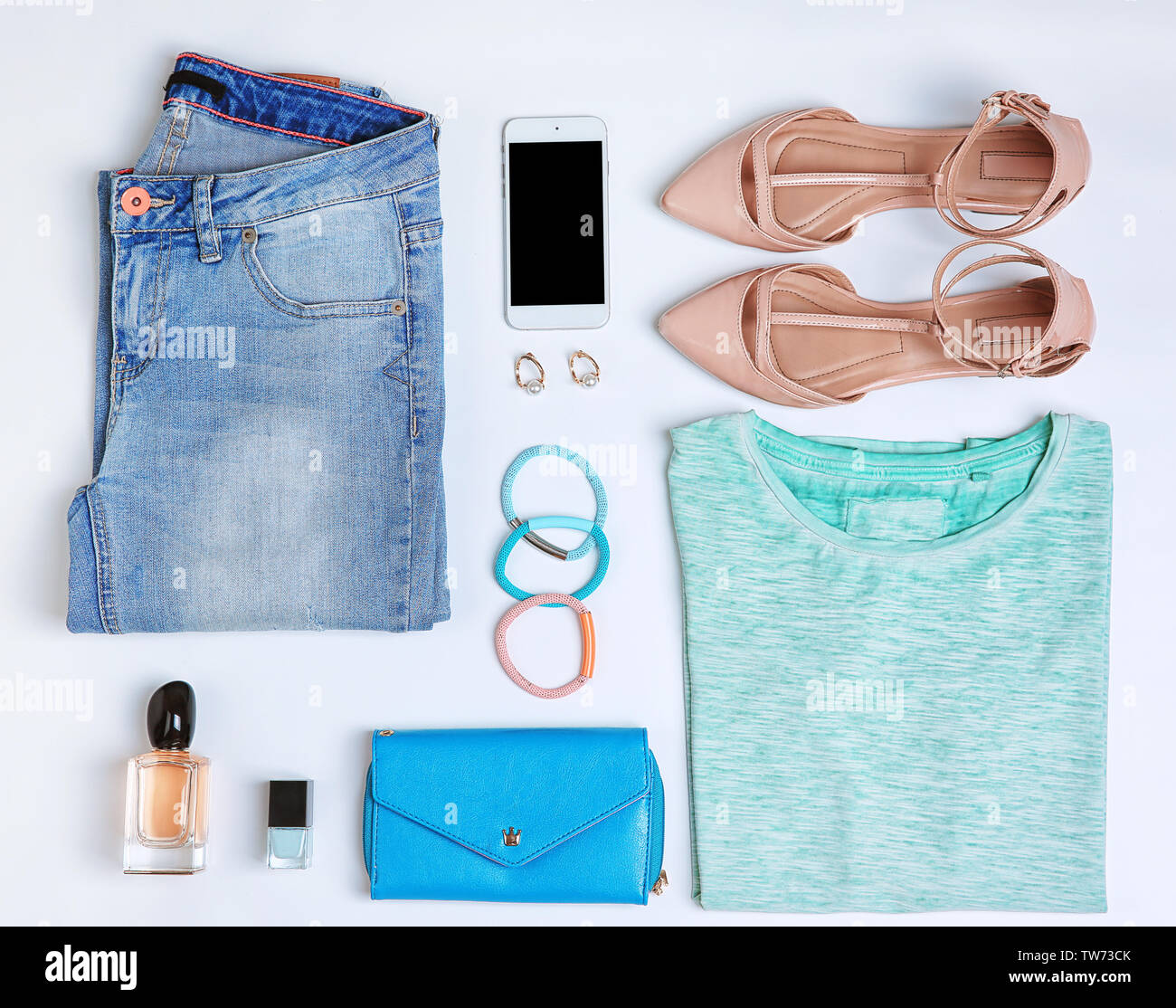 Composition with clothes and accessories on white background Stock Photo