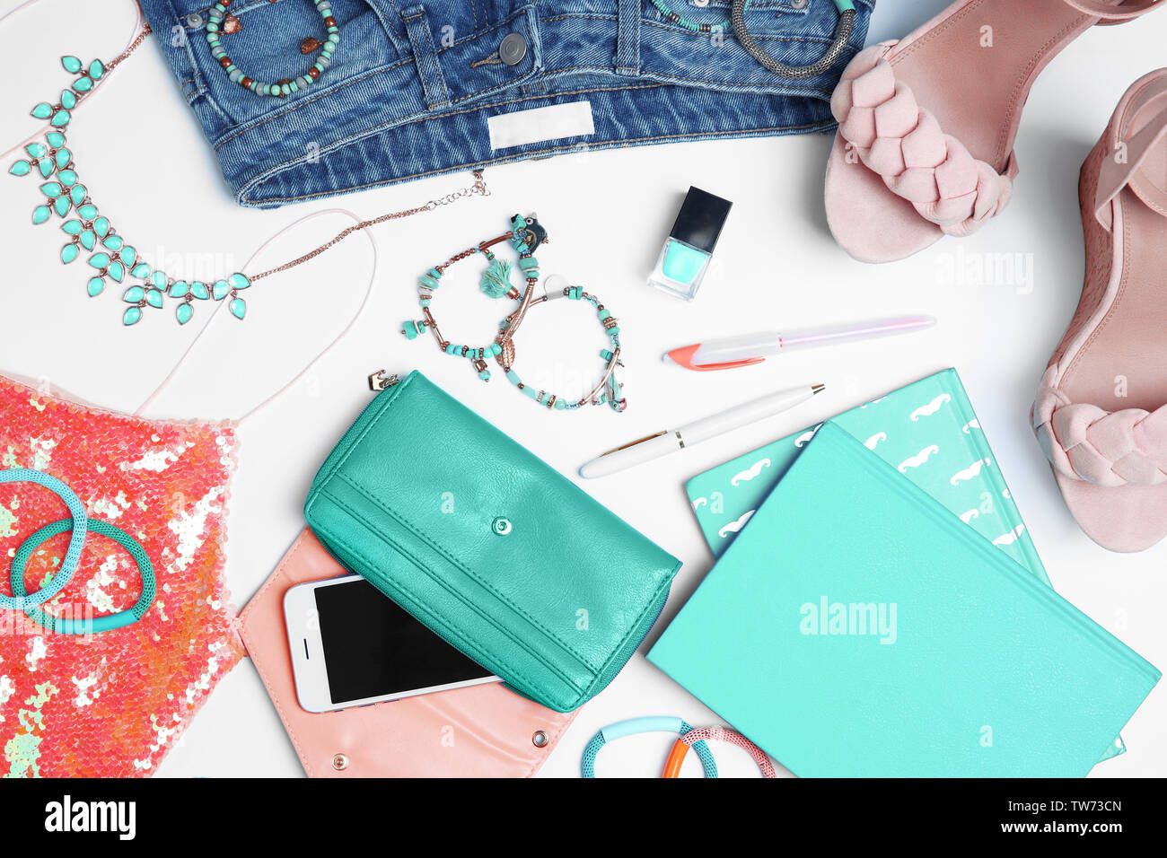Composition with clothes and accessories on light background Stock Photo