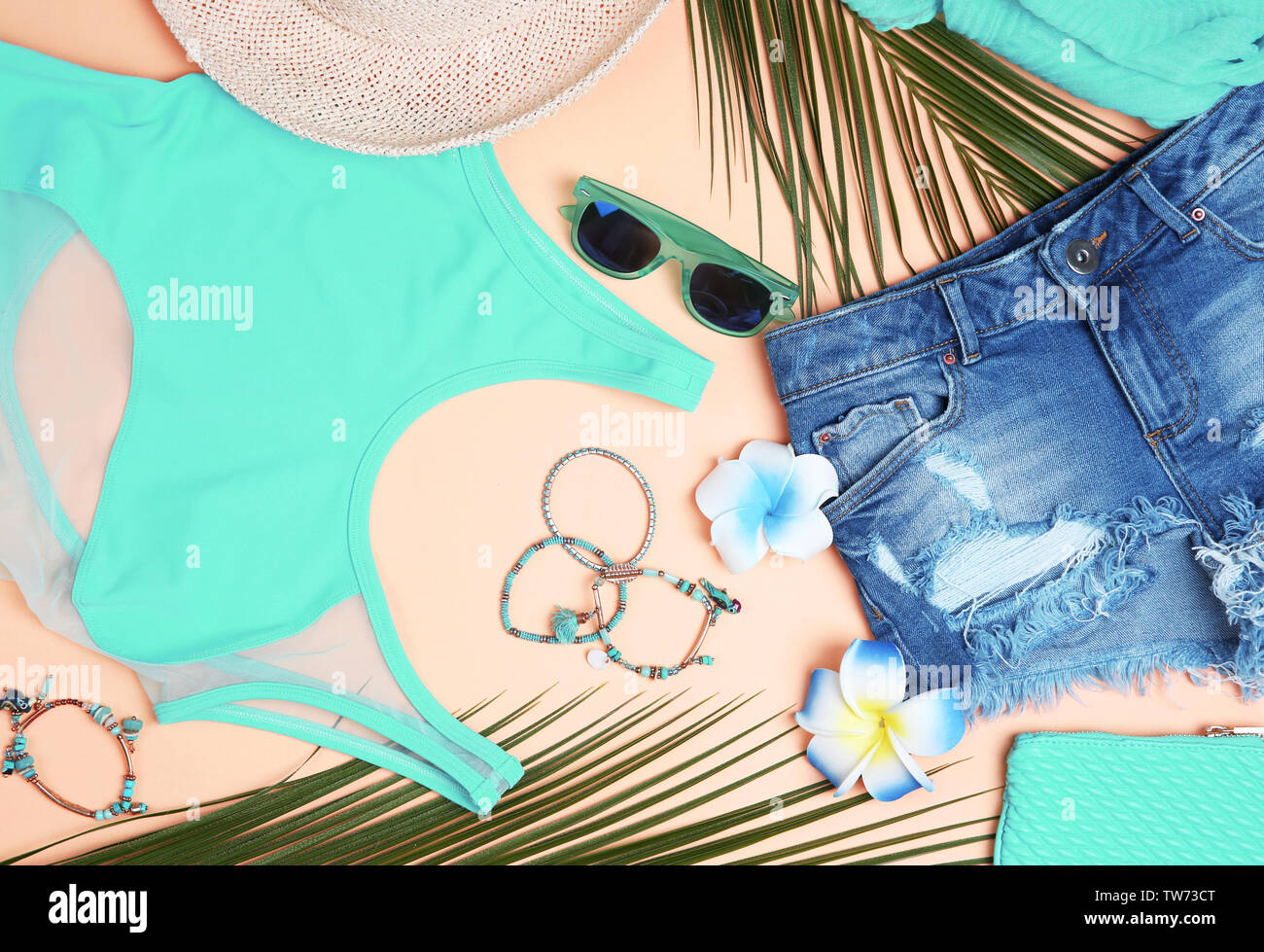Composition with mint clothes and accessories on apricot background Stock Photo