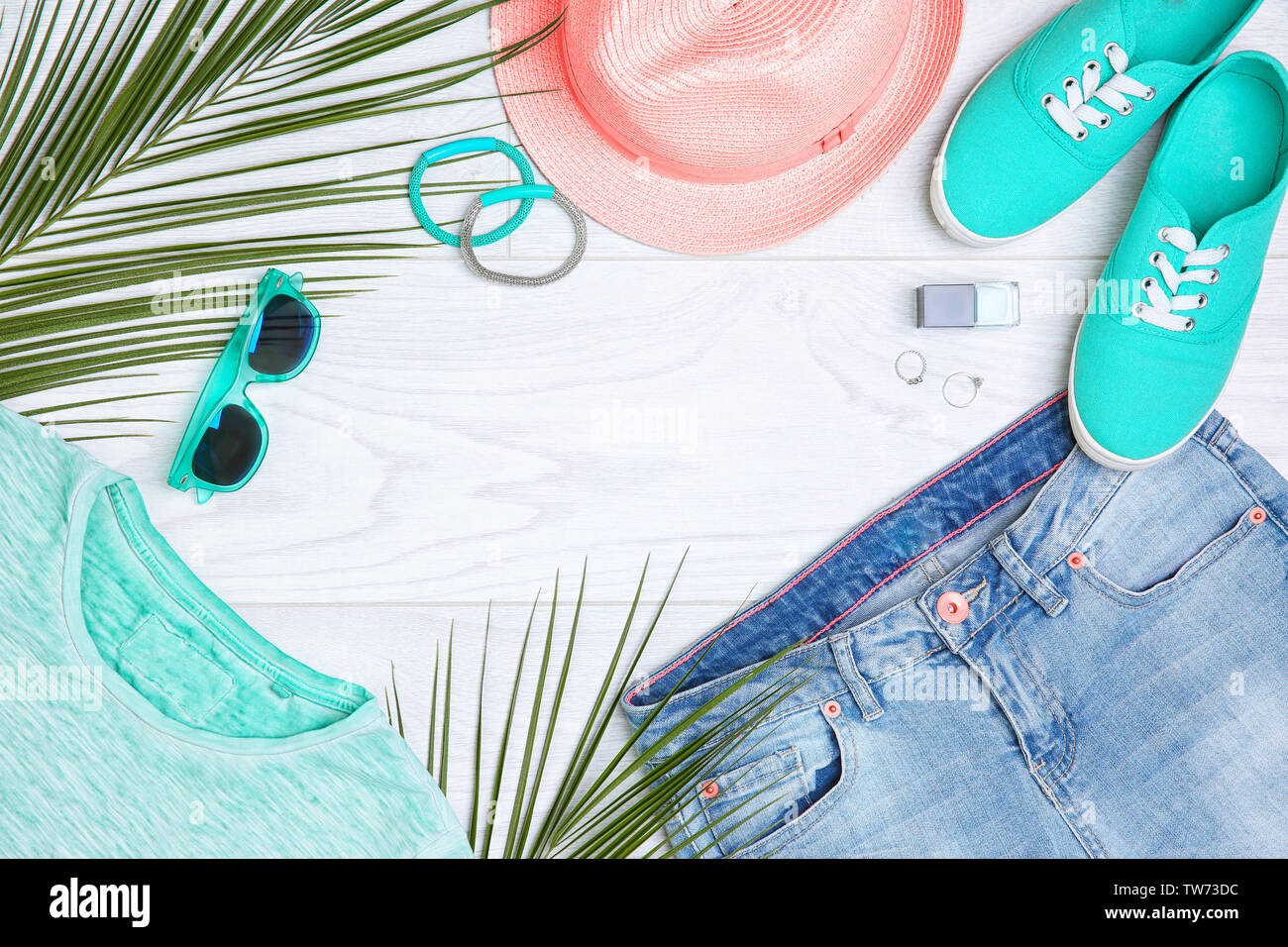 Composition with mint clothes and accessories on light background Stock Photo