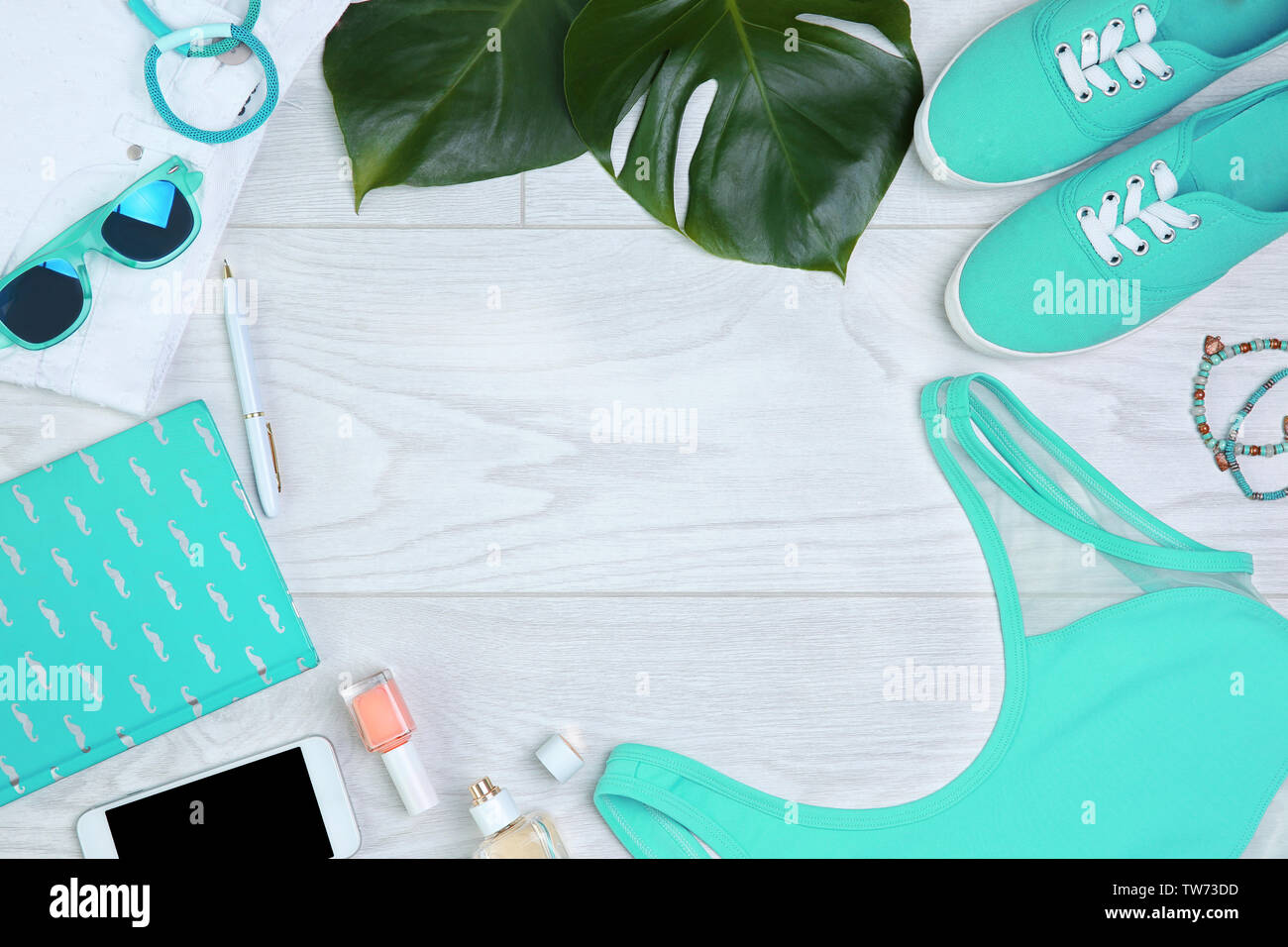 Composition with mint clothes and accessories on light background Stock Photo