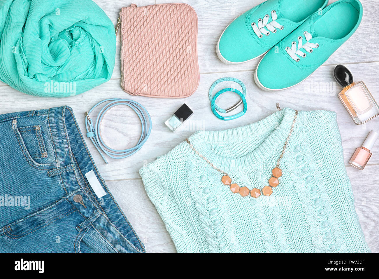 Composition with mint clothes and accessories on light background Stock Photo