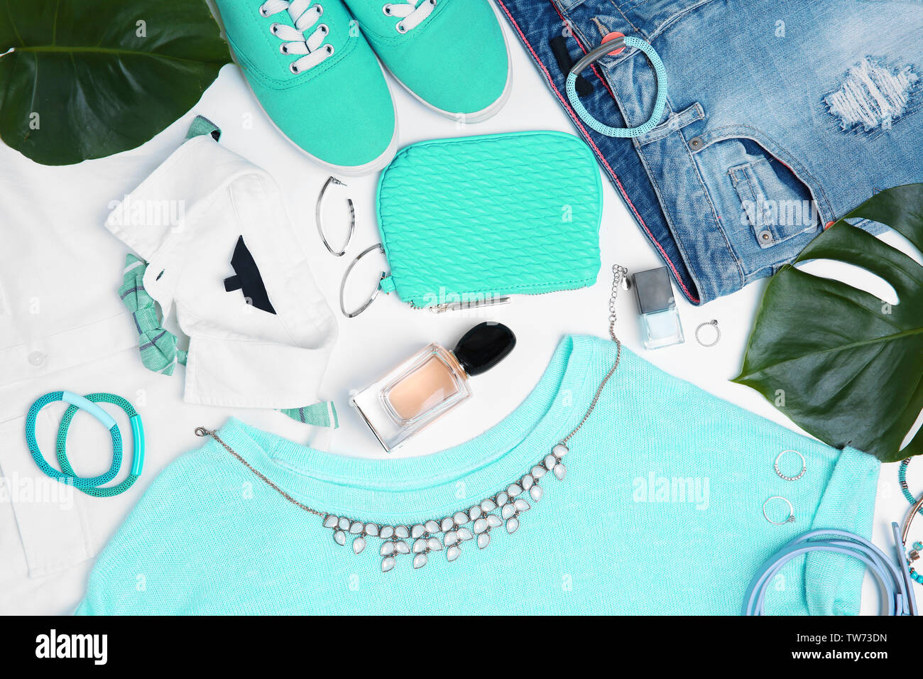 Composition with clothes and accessories on white background Stock Photo