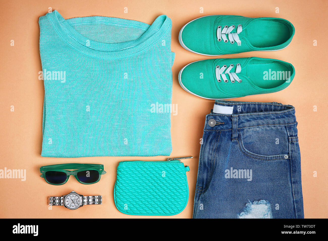 Composition with mint clothes and accessories on apricot background Stock Photo