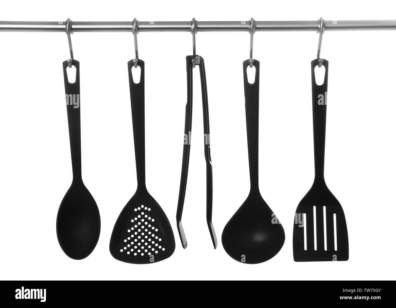 Set of cooking utensils hanging on rack, isolated on white Stock Photo
