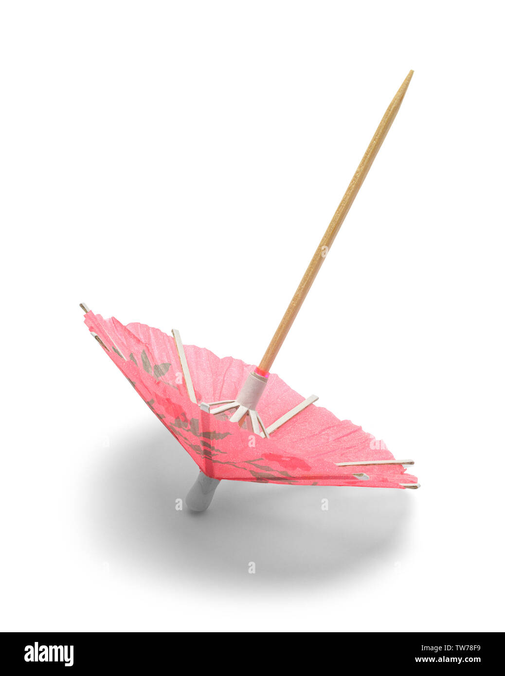 Pink Cocktail Umbrella Tipped Over Isolated on White. Stock Photo
