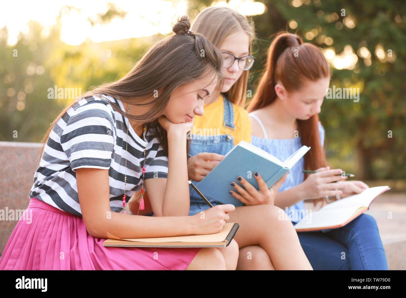 Cute teenagers spending time outdoors Stock Photo