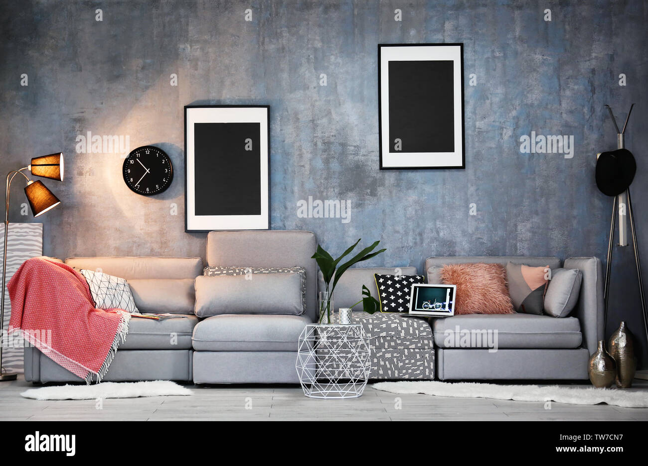 Modern living room design with grey couch Stock Photo Alamy