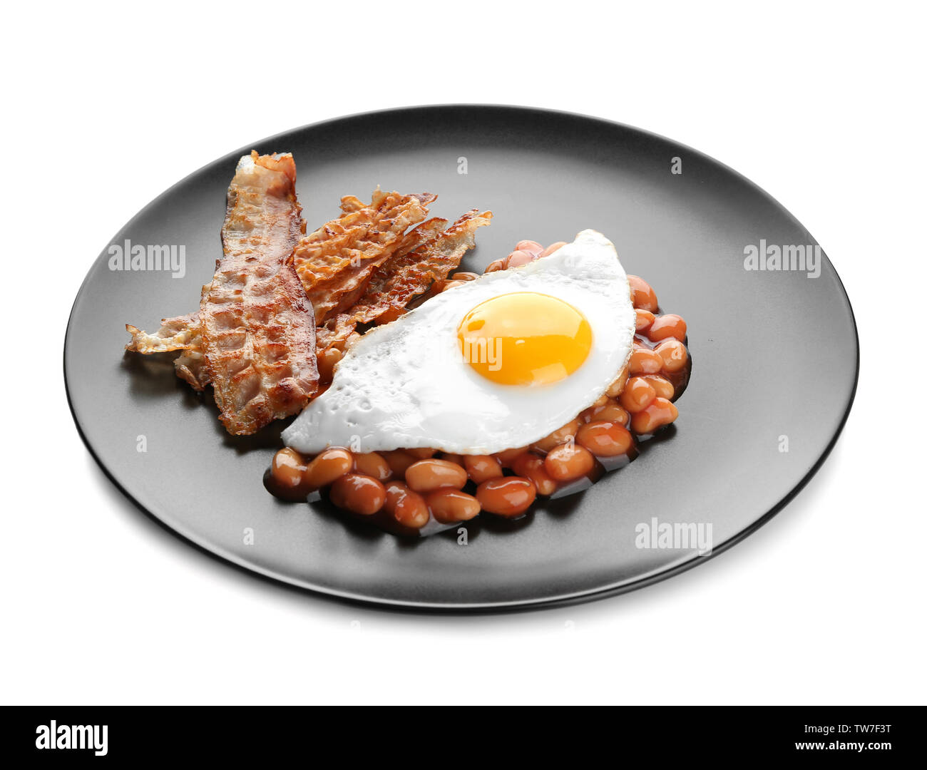 Plate with fried egg, bacon and beans on white background Stock Photo ...
