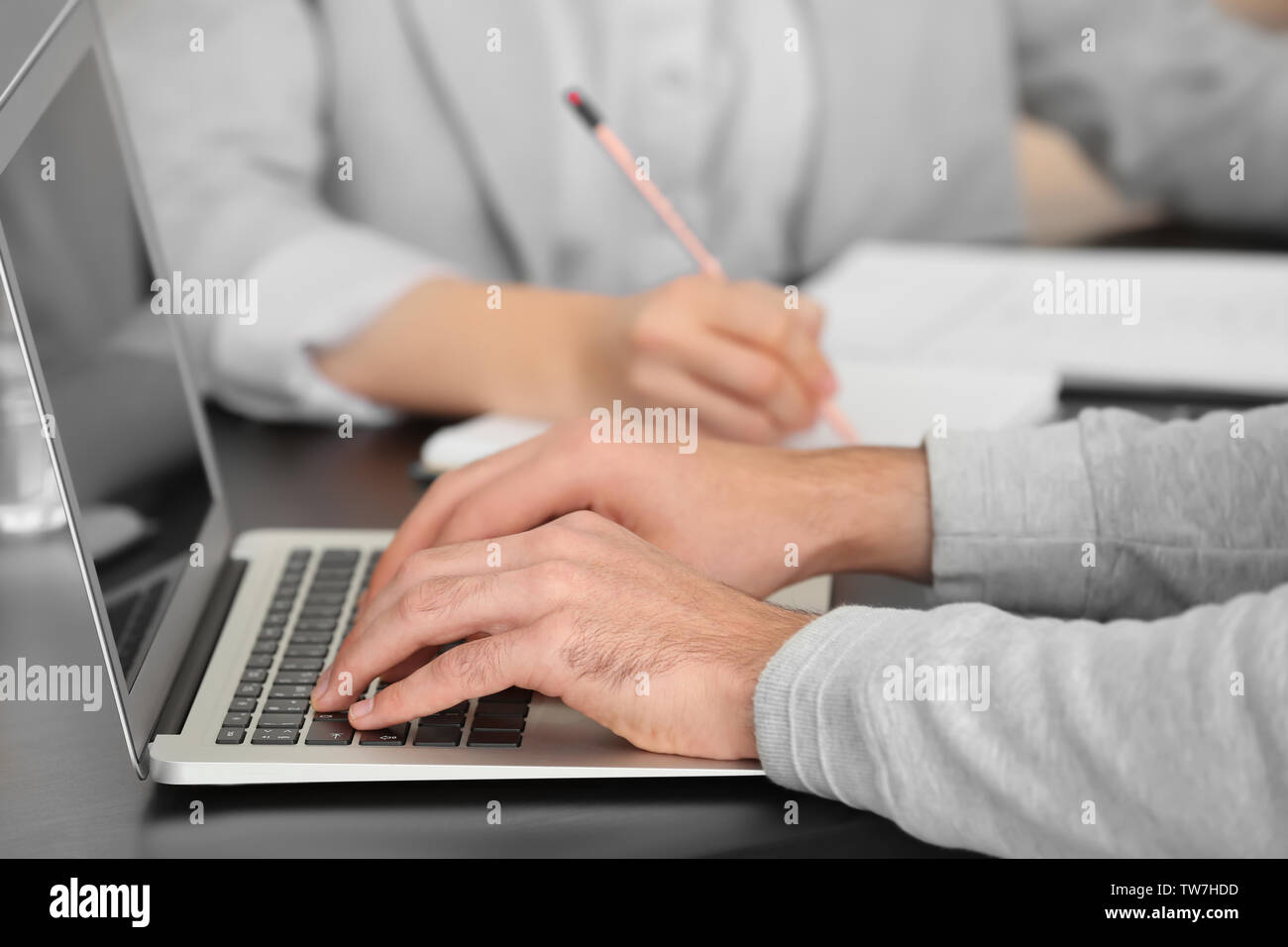 Manager working with laptop in office Stock Photo