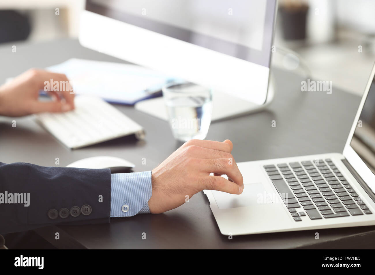 Manager working with laptop in office Stock Photo