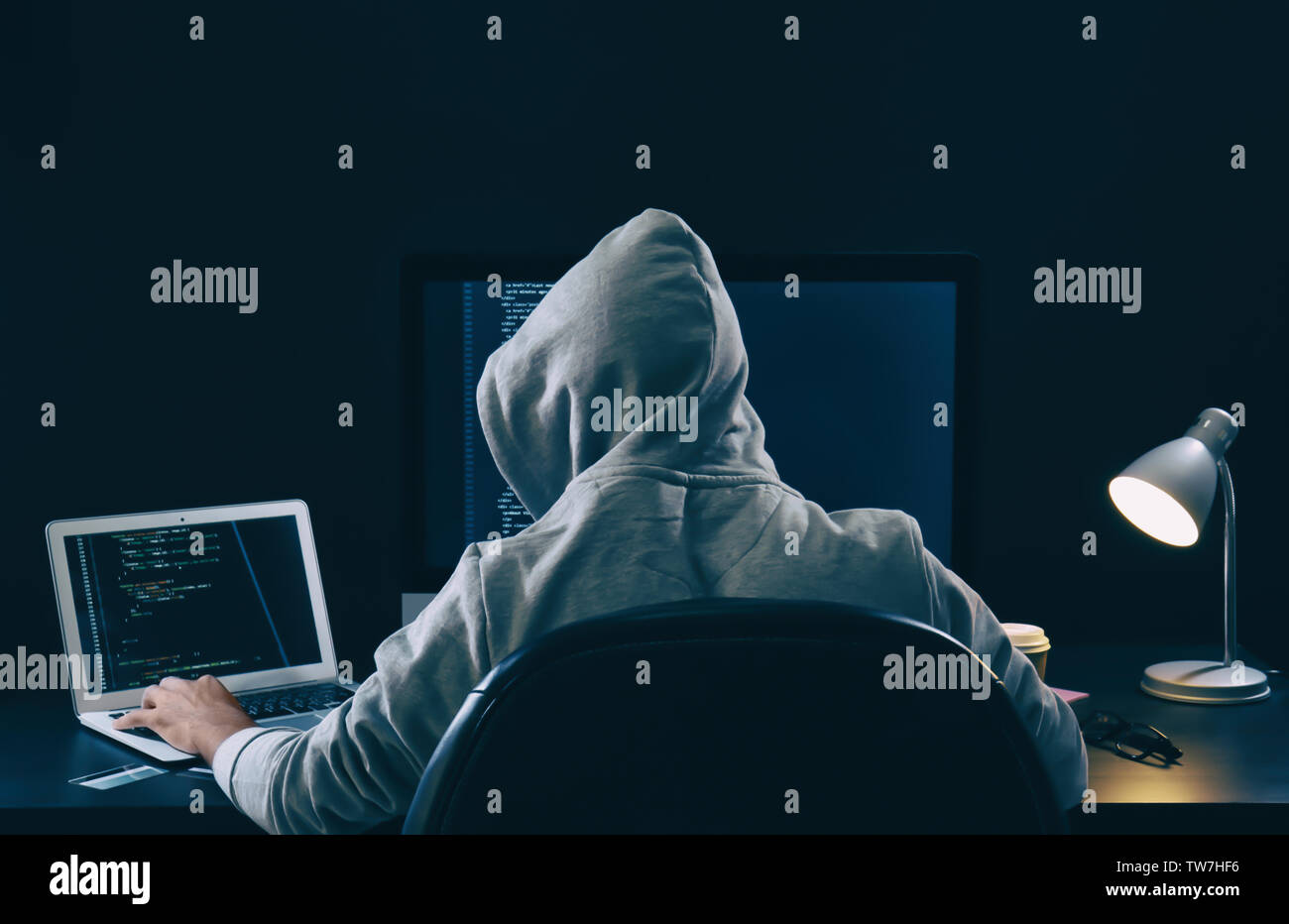 Hacking programmer wearing hoodie hi-res stock photography and images ...