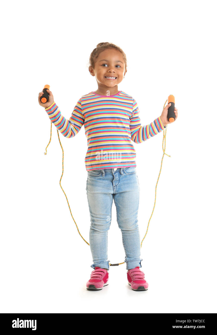 Cute African American girl skipping rope on white background Stock ...
