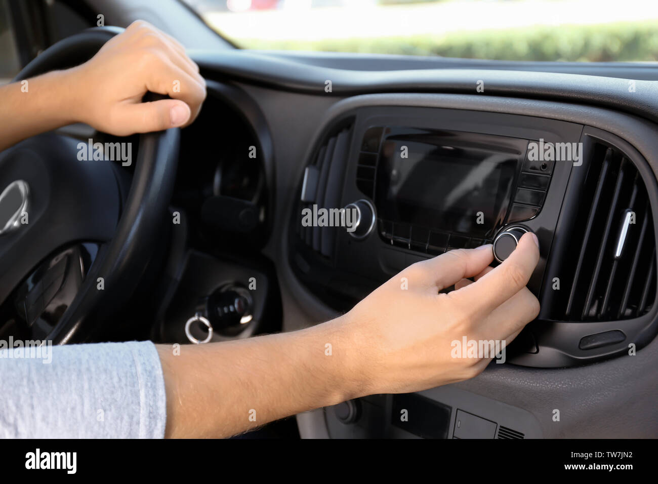 Man tuning car radio, closeup Stock Photo Alamy
