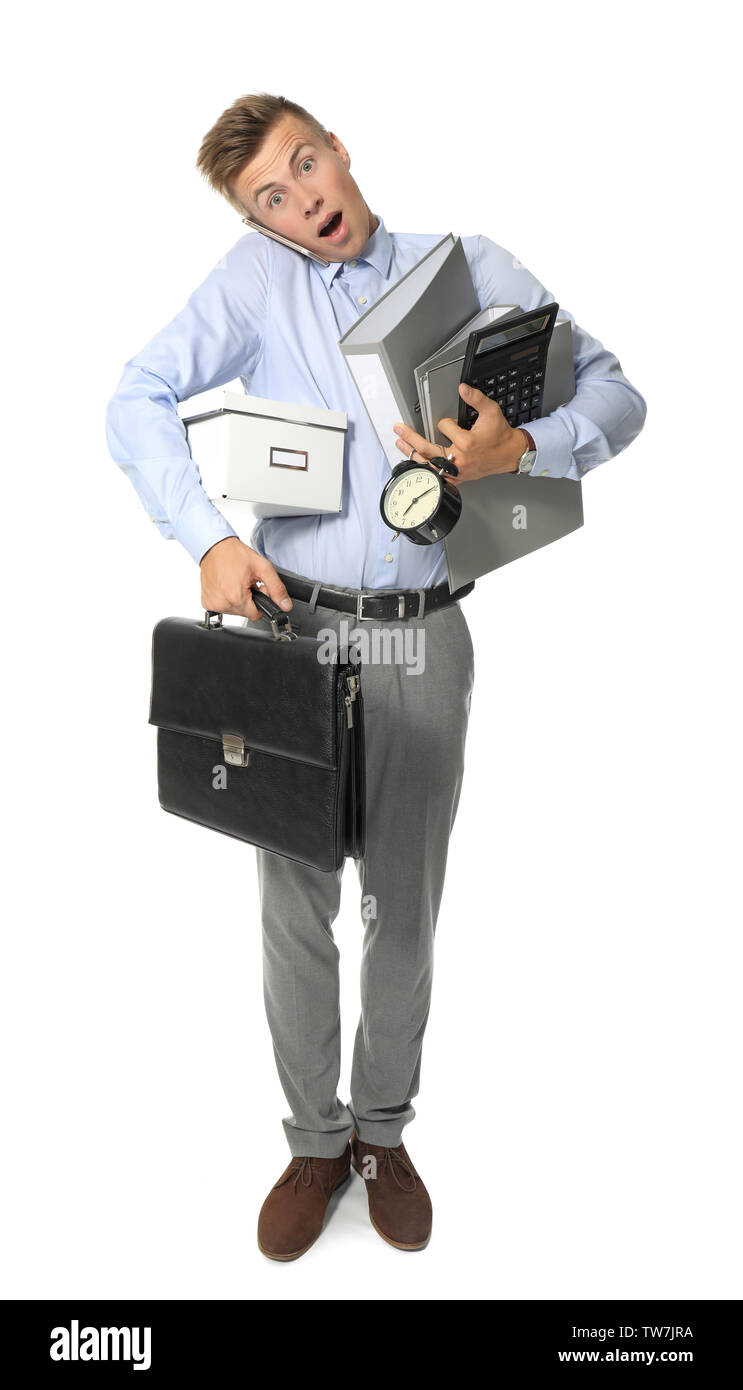 Young manager holding multiple things, isolated on white Stock Photo