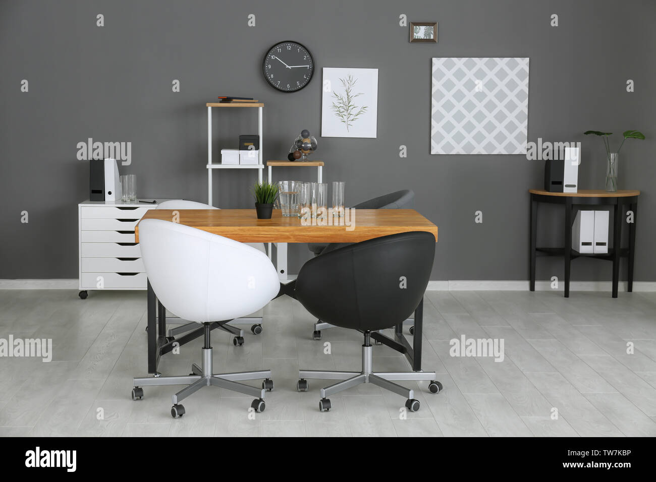 Modern office interior with black and white armchairs Stock Photo - Alamy